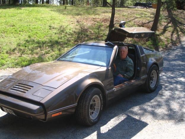 A man sitting in a Bricklin.